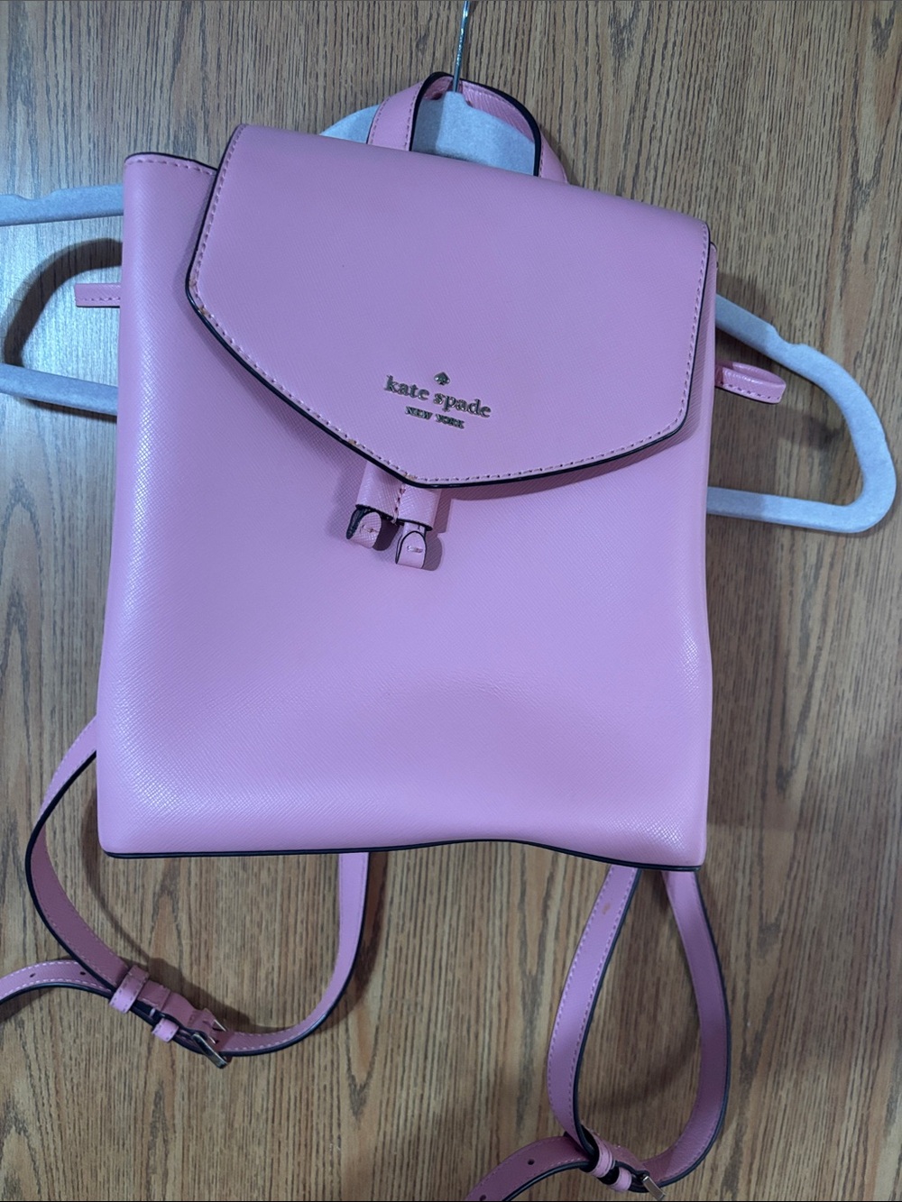 kate spade pink saffiano leather backpack with gold logo